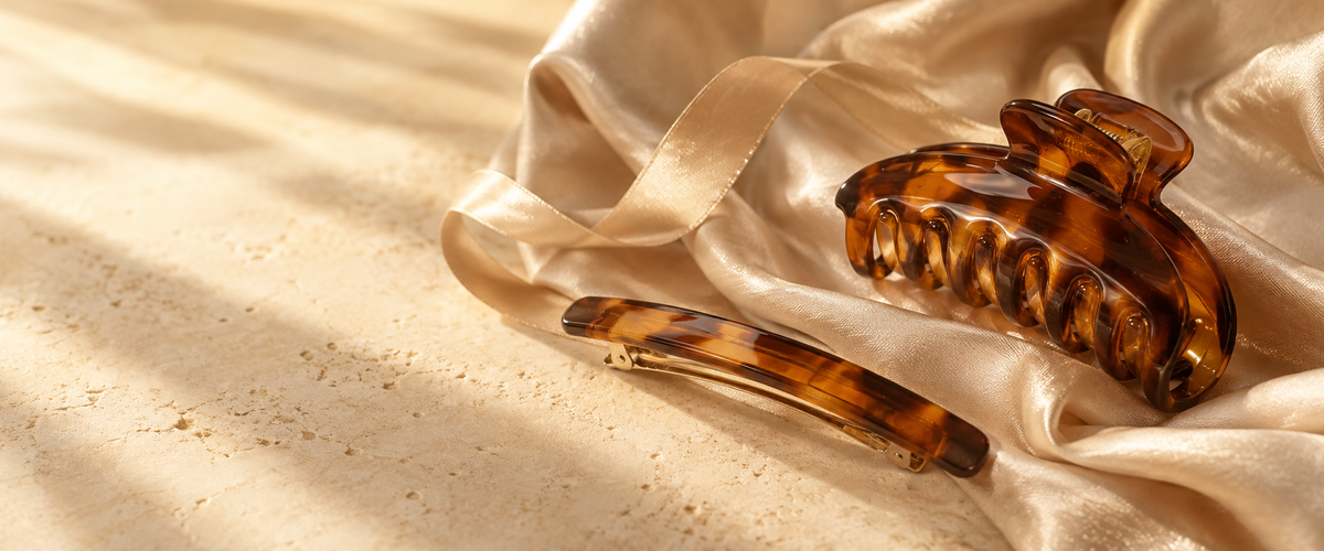 Amber hair accessories arranged on champagne satin